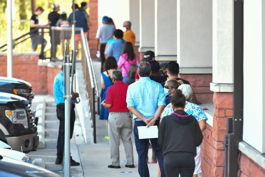 Voters waited outside of the Bexar County Elections Department in San Antonio to drop off their mail-in ballots, voter registration applications or be trained as poll workers on Oct. 5. The Texas Supreme Court ruled against several GOP officials who pushed to keep early voting to a two-week period during the pandemic.